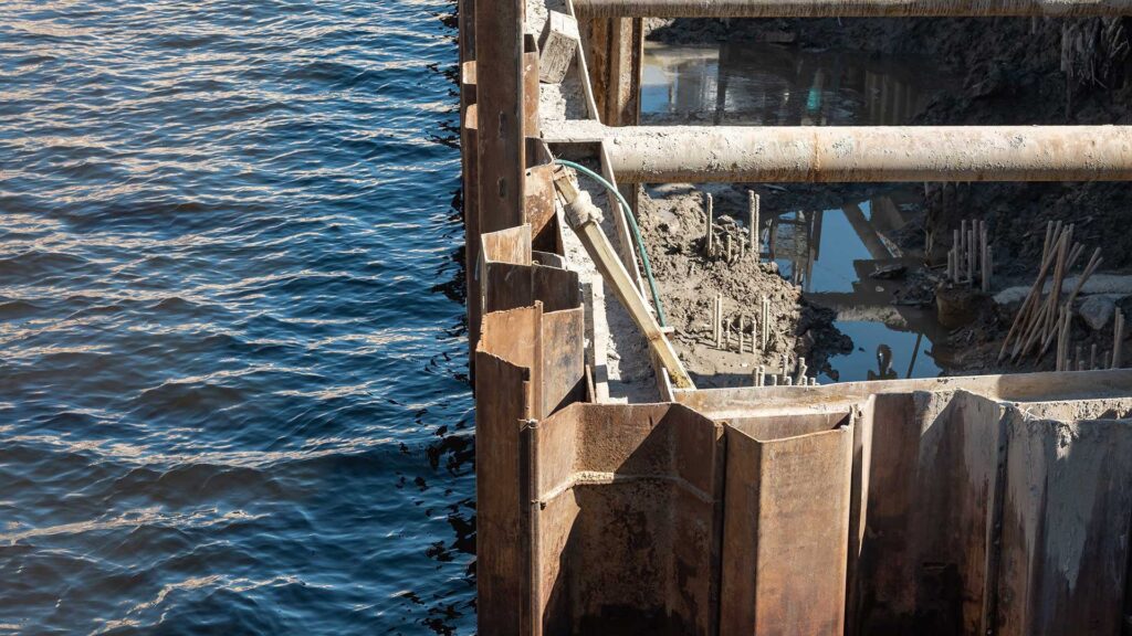 Steel sheet piling and pipes used for shoreline or excavation support next to water